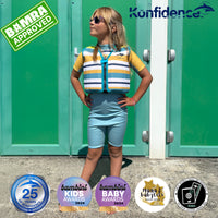 Person wearing a striped life jacket and shorts with various awards and logos displayed.